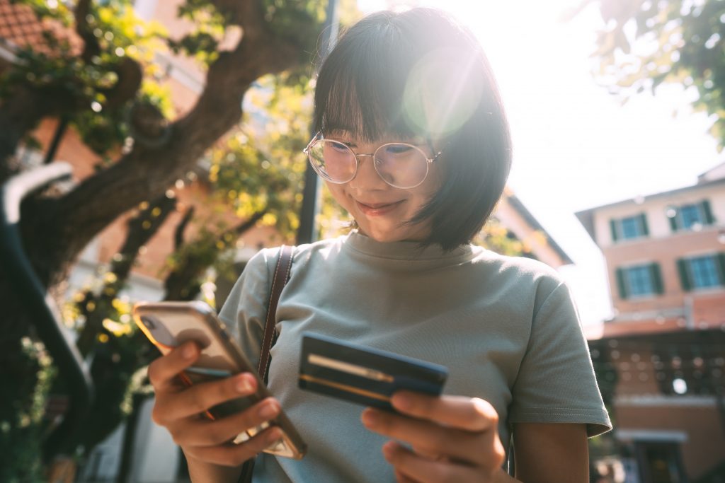 Young adult business asian woman consumer using credit card