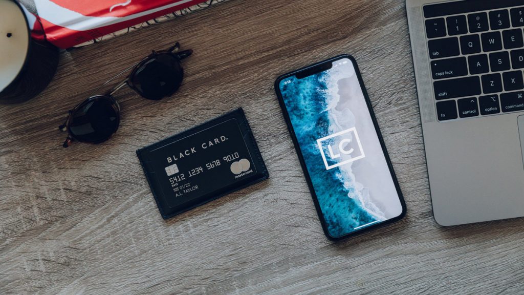 Luxury Black card with a mobile and laptop