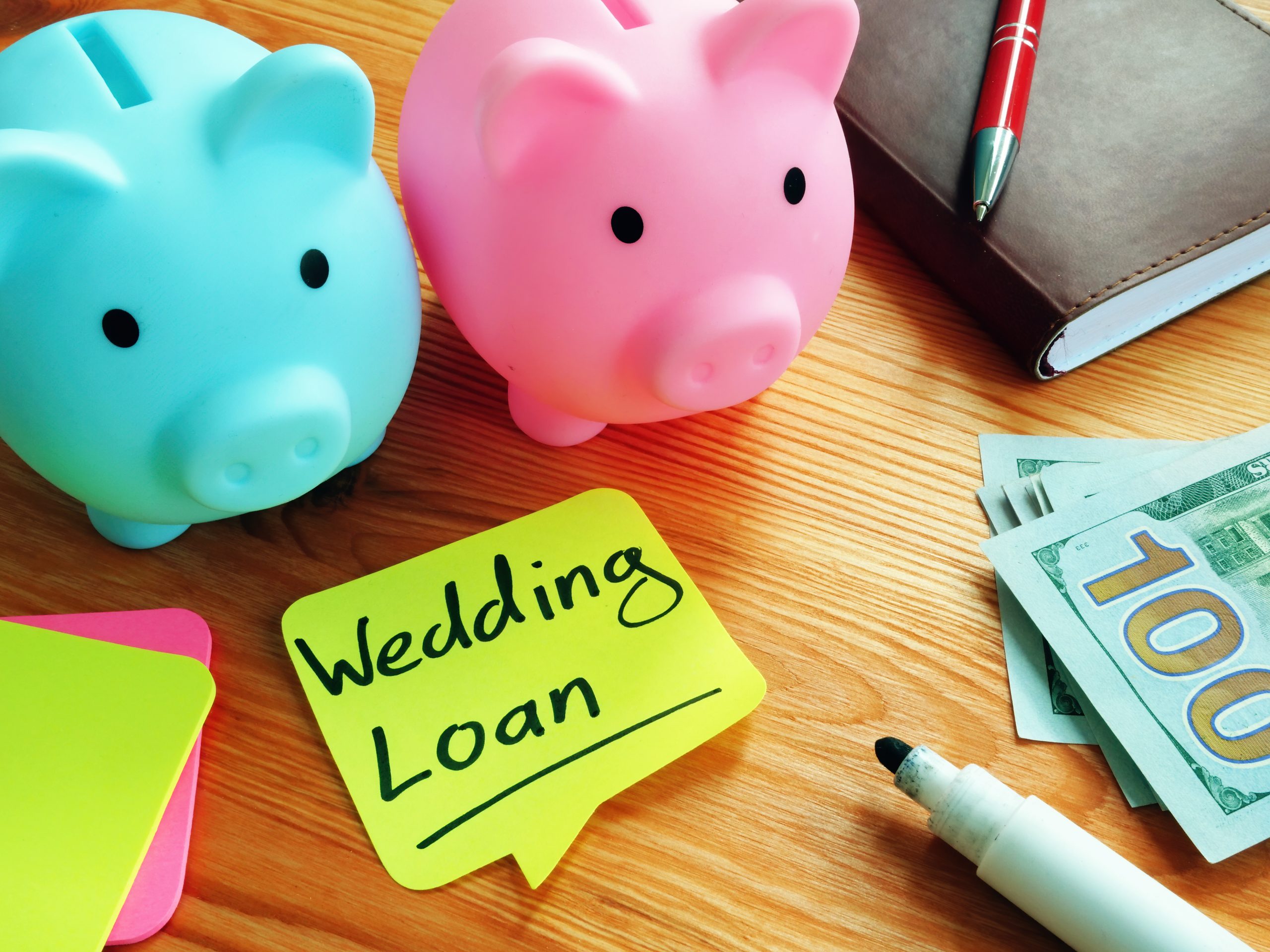 Wedding Loan memo and two piggy banks.