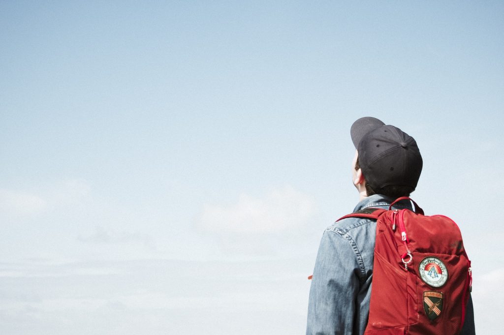 student looking at a clear blue sky