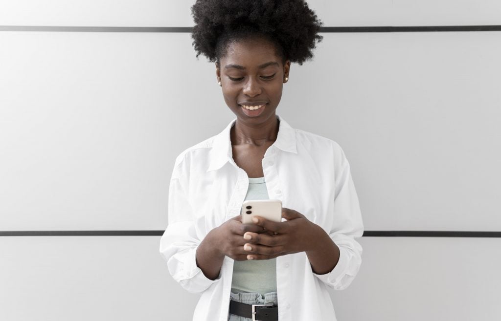 african-american-woman-texting-someone-her-smartphone