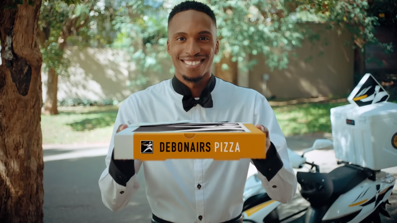 Man delivering Debonairs pizza