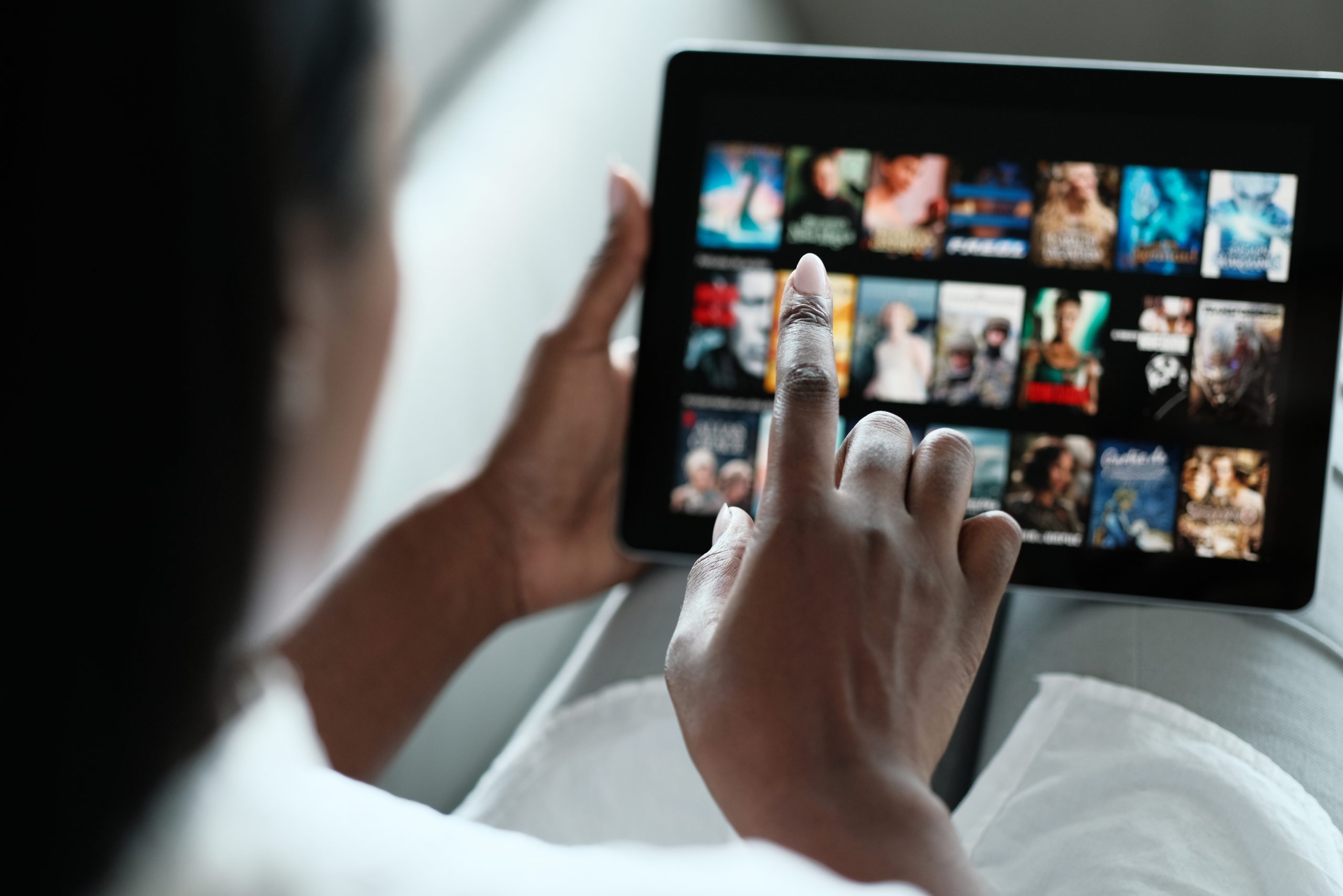 Black Woman Browsing Movie On Streaming Media Service